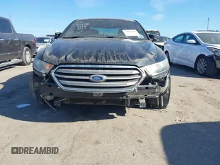2014 Ford Taurus SEL z VIN 1FAHP2E84EG170133, wystawiony jako IAAI lot #41045369 z przebiegiem 261 732 mil mil oraz . Historia ofert i sprzedaży dostępna na DreamBid. Obrazek 6.