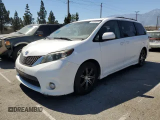2011 Toyota Sienna SE with VIN 5TDXK3DC9BS132429, listed as a Copart auction lot 64463915 with 112,982 mi miles and Salvage title. Bid and sale history available at DreamBid. Image 1.