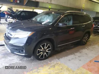 2020 Honda Pilot Touring 8-Passenger with VIN 5FNYF6H90LB043055, listed as a Copart auction lot 85194544 with 82,144 mi miles and Salvage Title. Bid and sale history available at DreamBid. Image 1.