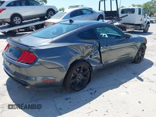 2020 Ford Mustang EcoBoost z VIN 1FA6P8TH1L5183279, wystawiony jako IAAI lot #41904731 z przebiegiem 99 222 mil mil oraz . Historia ofert i sprzedaży dostępna na DreamBid. Obrazek 4.