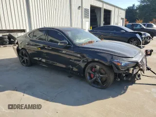 2021 Genesis G70 3.3T with VIN KMTG34LE7MU066534, listed as a Copart auction lot 77532704 with 58,951 mi miles and Salvage Title. Bid and sale history available at carsss.com. Image 4.