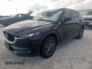 2021 Mazda CX-5 Touring z VIN JM3KFBCM2M1499585, wystawiony jako Copart lot #54876185 z przebiegiem 57 704 mil mil oraz Szkoda całkowita • Salvage title. Historia ofert i sprzedaży dostępna na DreamBid. Obrazek 1.