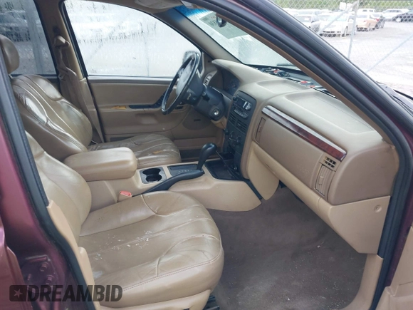 2000 Jeep Grand Cherokee Laredo with VIN 1J4G248S0YC351033, listed as a IAAI auction lot 42165830 with 145,351 mi miles and . Bid and sale history available at DreamBid. Image 5.