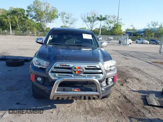 2018 Toyota Tacoma SR5 with VIN 3TMAZ5CN4JM069965, listed as a IAAI auction lot 41798238 with 124,619 mi miles and . Bid and sale history available at DreamBid. Image 13.
