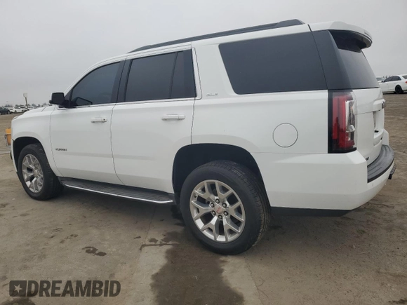 2015 GMC Yukon SLE with VIN 1GKS1AKC8FR733084, listed as a Copart auction lot 82960064 with 163,576 mi miles and Salvage Title. Bid and sale history available at carsss.com. Image 2.