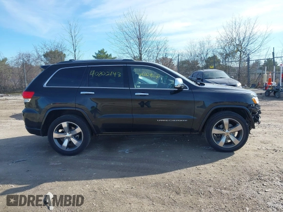 2014 Jeep Grand Cherokee Overland with VIN 1C4RJECG4EC523747, listed as a IAAI auction lot 40802143 with 124,079 mi miles. Bid and sale history available at carsss.com. Image 13.