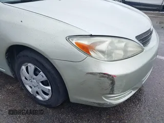 2002 Toyota Camry LE z VIN JTDBE32K220022434, wystawiony jako IAAI lot #42194752 z przebiegiem 168 955 mil mil oraz . Historia ofert i sprzedaży dostępna na DreamBid. Obrazek 12.