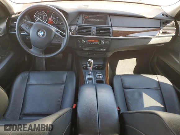 2012 BMW X5 35i with VIN 5UXZV4C5XCL987618, listed as a Copart auction lot 60308965 with 98,195 mi miles and Salvage title. Bid and sale history available at DreamBid. Image 8.