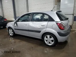 2009 Kia Rio LX with VIN KNADE243196496923, listed as a Copart auction lot 44235725 with 103,171 mi miles and Salvage Title. Bid and sale history available at carsss.com. Image 2.