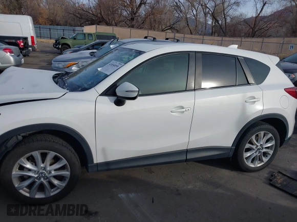 2015 Mazda CX-5 Grand Touring with VIN JM3KE4DY3F0483629, listed as a IAAI auction lot 41054059 with 118,980 mi miles. Bid and sale history available at carsss.com. Image 13.