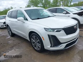 2021 Cadillac XT6 Premium Luxury z VIN 1GYKPDRS0MZ141453, wystawiony jako IAAI lot #42215954 z przebiegiem 144 245 mil mil oraz . Historia ofert i sprzedaży dostępna na DreamBid. Obrazek 1.
