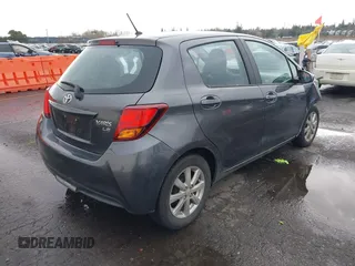 2015 Toyota Yaris L with VIN VNKKTUD38FA043393, listed as a IAAI auction lot 41573010 with 107,146 mi miles and . Bid and sale history available at DreamBid. Image 4.