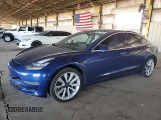 2020 Tesla Model 3 Standard Range Plus z VIN 5YJ3E1EA1LF744069, wystawiony jako Copart lot #53437085 z przebiegiem 121 845 mil mil oraz Szkody całkowita. Historia ofert i sprzedaży dostępna na DreamBid. Obrazek 1.