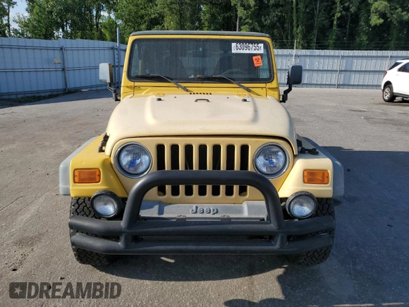 2000 Jeep Wrangler Sport with VIN 1J4FA49SXYP745676, listed as a Copart auction lot 63096755 with 147,226 mi miles and Salvage title. Bid and sale history available at DreamBid. Image 5.