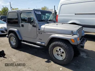 2002 Jeep Wrangler X with VIN 1J4FA39S32P708163, listed as a Copart auction lot 69703254 with 119,843 mi miles and Salvage Title. Bid and sale history available at carsss.com. Image 4.