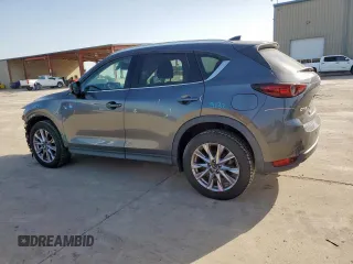 2019 Mazda CX-5 Grand Touring with VIN JM3KFADM8K1634011, listed as a Copart auction lot 57343455 with 67,138 mi miles and Salvage title. Bid and sale history available at DreamBid. Image 2.