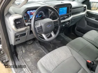 2021 Ford F-150 XL with VIN 1FTMF1EP7MKE58611, listed as a Copart auction lot 56912955 with 30,850 mi miles and Salvage title. Bid and sale history available at DreamBid. Image 8.