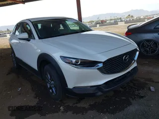 2023 Mazda CX-30 S with VIN 3MVDMBAM6PM523340, listed as a IAAI auction lot 41562829 with 22,681 mi miles and . Bid and sale history available at carsss.com. Image 1.