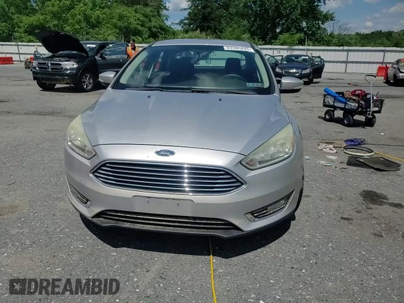 2015 Ford Focus Titanium with VIN 1FADP3J27FL267339, listed as a Copart auction lot 63395835 with 73,372 mi miles and Salvage title. Bid and sale history available at DreamBid. Image 13.