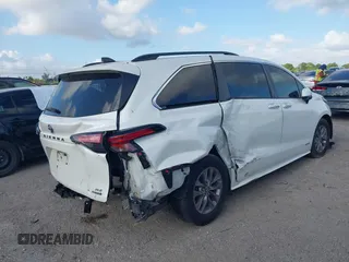 2021 Toyota Sienna XLE with VIN 5TDYRKEC7MS017968, listed as a IAAI auction lot 42145440 with 85,989 mi miles and . Bid and sale history available at DreamBid. Image 4.