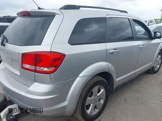2013 Dodge Journey SE z VIN 3C4PDCAB9DT529668, wystawiony jako IAAI lot #42130654 z przebiegiem 156 472 mil mil oraz . Historia ofert i sprzedaży dostępna na DreamBid. Obrazek 4.