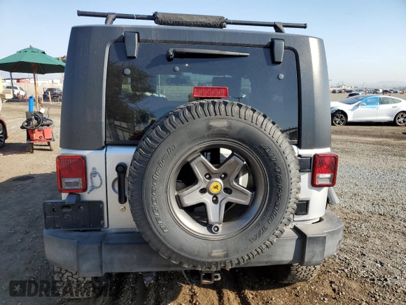 2009 Jeep Wrangler Rubicon with VIN 1J4GA64149L757121, listed as a Copart auction lot 74258934 with 73,241 mi miles and Salvage Title. Bid and sale history available at DreamBid. Image 6.