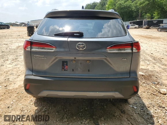 2022 Toyota Corolla Cross LE z VIN 7MUCAAAG8NV017408, wystawiony jako Copart lot #59096555 z przebiegiem 33 703 mil mil oraz Szkoda całkowita • Salvage title. Historia ofert i sprzedaży dostępna na DreamBid. Obrazek 6.