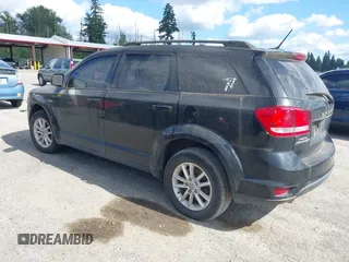 2015 Dodge Journey SXT z VIN 3C4PDCBG5FT742257, wystawiony jako IAAI lot #42577447 z przebiegiem 128 816 mil mil oraz . Historia ofert i sprzedaży dostępna na DreamBid. Obrazek 3.