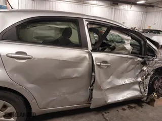 2013 Kia Rio LX with VIN KNADM5A31D6274318, listed as a IAAI auction lot 40986091 with 182,000 mi miles. Bid and sale history available at carsss.com. Image 19.