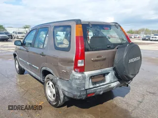2003 Honda CR-V LX with VIN JHLRD68513C009276, listed as a IAAI auction lot 41563452 with 240,519 mi miles and . Bid and sale history available at DreamBid. Image 6.