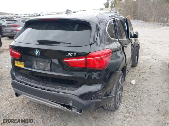 2018 BMW X1 xDrive28i with VIN WBXHT3C34J5K21576, listed as a IAAI auction lot 41822390 with 69,645 mi miles. Bid and sale history available at carsss.com. Image 4.