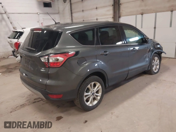 2017 Ford Escape SE with VIN 1FMCU9G90HUC96633, listed as a IAAI auction lot 42005904 with 93,139 mi miles. Bid and sale history available at carsss.com. Image 4.