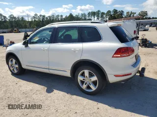 2014 Volkswagen Touareg Lux z VIN WVGEF9BP4ED011436, wystawiony jako Copart lot #74207144 z przebiegiem 207 059 mil mil oraz Szkoda całkowita • Salvage title. Historia ofert i sprzedaży dostępna na DreamBid. Obrazek 2.