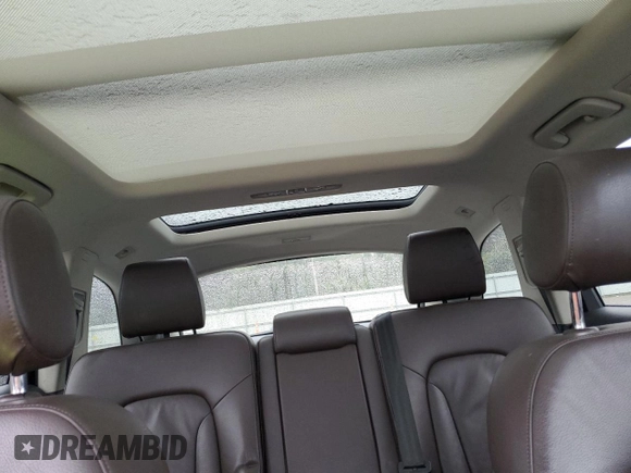 2014 Audi Q7 Premium Plus z VIN WA1LMAFE7ED007998, wystawiony jako Copart lot #65349044 z przebiegiem Nie podano mil oraz Nie do naprawy • Non repairable. Historia ofert i sprzedaży dostępna na DreamBid. Obrazek 10.