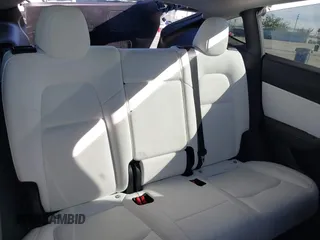 2021 Tesla Model Y Standard Range z VIN 5YJYGDED4MF162982, wystawiony jako IAAI lot #41378674 z przebiegiem 60 267 mil mil oraz . Historia ofert i sprzedaży dostępna na DreamBid. Obrazek 8.