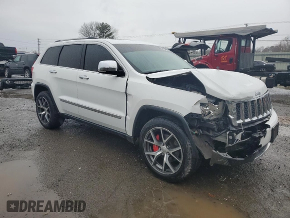 2013 Jeep Grand Cherokee Overland with VIN 1C4RJECT2DC590911, listed as a Copart auction lot 42939405 with 136,673 mi miles and Salvage Title. Bid and sale history available at carsss.com. Image 4.