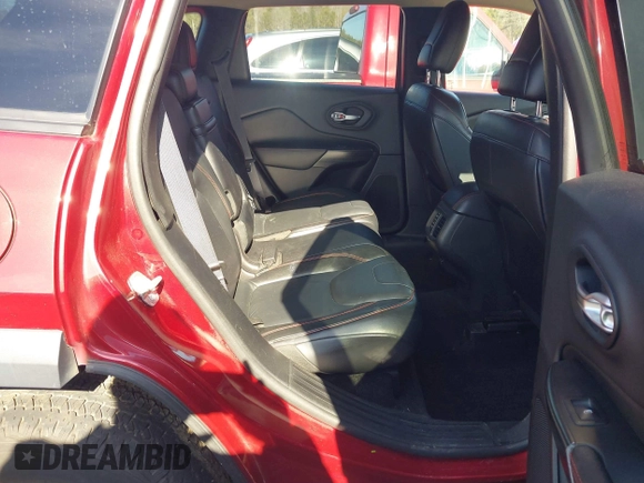 2014 Jeep Cherokee Trailhawk with VIN 1C4PJMBS0EW257133, listed as a IAAI auction lot 41446095 with 82,285 mi miles and . Bid and sale history available at DreamBid. Image 8.