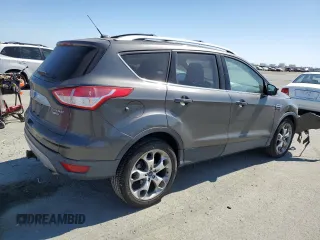 2015 Ford Escape Titanium with VIN 1FMCU9J99FUC13108, listed as a Copart auction lot 60815265 with 70,938 mi miles and Salvage title. Bid and sale history available at DreamBid. Image 3.