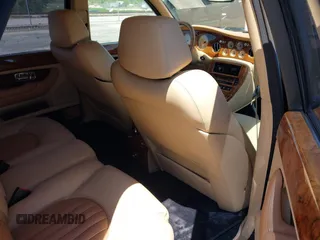 1999 Bentley Arnage z VIN SCBLB51E1XCX01401, wystawiony jako IAAI lot #42133144 z przebiegiem 29 699 mil mil oraz . Historia ofert i sprzedaży dostępna na DreamBid. Obrazek 8.