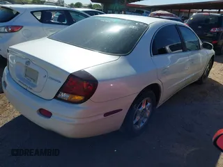 2001 Oldsmobile Aurora z VIN 1G3GR64H414288395, wystawiony jako IAAI lot #42260825 z przebiegiem 246 744 mil mil oraz . Historia ofert i sprzedaży dostępna na DreamBid. Obrazek 4.
