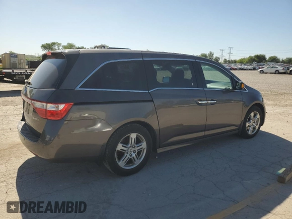 2011 Honda Odyssey Touring с VIN 5FNRL5H94BB078137, выставлен на аукционе Copart как лот 57467505 с пробегом 210 405 миль миль и Списание • Salvage title. История ставок и продаж доступна на DreamBid. Изображение 3.