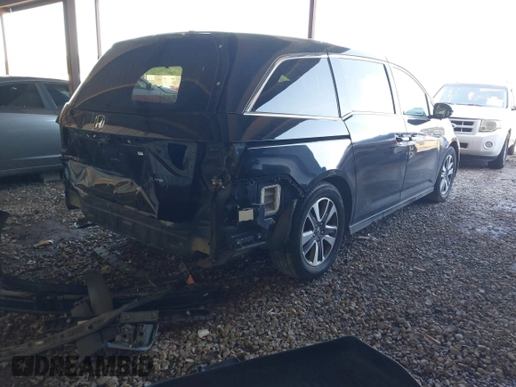 2014 Honda Odyssey Touring with VIN 5FNRL5H94EB110590, listed as a IAAI auction lot 42092929 with 242,338 mi miles and . Bid and sale history available at DreamBid. Image 4.