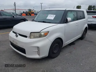 2014 Scion xB with VIN JTLZE4FEXEJ054060, listed as a IAAI auction lot 42096159 with 211,994 mi miles. Bid and sale history available at carsss.com. Image 2.