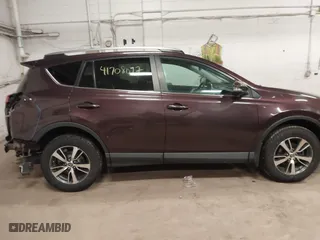 2017 Toyota RAV4 XLE with VIN 2T3RFREV3HW679851, listed as a IAAI auction lot 41708097 with 128,482 mi miles. Bid and sale history available at carsss.com. Image 14.
