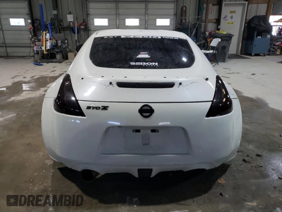2012 Nissan 370Z z VIN JN1AZ4EH2CM564443, wystawiony jako Copart lot #45126885 z przebiegiem 71 729 mil mil oraz Szkody całkowita. Historia ofert i sprzedaży dostępna na DreamBid. Obrazek 6.