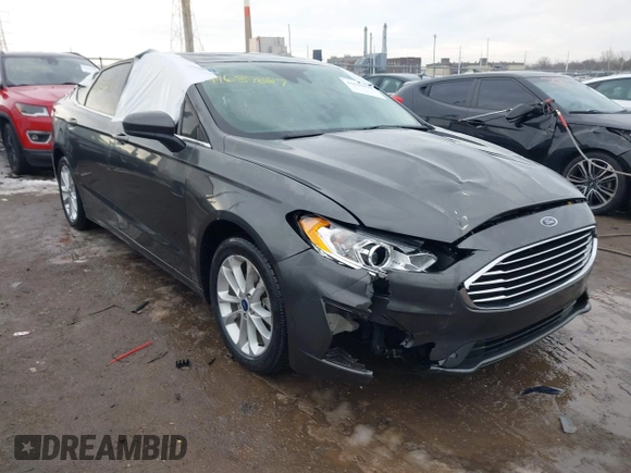 2020 Ford Fusion SE z VIN 3FA6P0LU6LR185721, wystawiony jako IAAI lot #41639827 z przebiegiem 63 857 mil mil oraz . Historia ofert i sprzedaży dostępna na DreamBid. Obrazek 1.