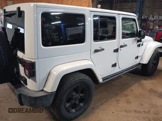 2015 Jeep Wrangler Unlimited Sahara with VIN 1C4BJWEG8FL696581, listed as a IAAI auction lot 41923093 with 193,421 mi miles and . Bid and sale history available at DreamBid. Image 4.