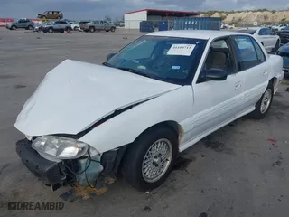 1997 Pontiac Grand Am SE with VIN 1G2NE52T3VC809661, listed as a IAAI auction lot 41100711 with 168,686 mi miles. Bid and sale history available at carsss.com. Image 19.
