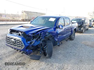2023 Toyota Tacoma 4WD SR with VIN 3TYCZ5AN1PT119133, listed as a IAAI auction lot 41574906 with 19,887 mi miles. Bid and sale history available at carsss.com. Image 2.