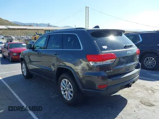 2016 Jeep Grand Cherokee Laredo z VIN 1C4RJFAG5GC390413, wystawiony jako IAAI lot #42254165 z przebiegiem 99 231 mil mil oraz . Historia ofert i sprzedaży dostępna na DreamBid. Obrazek 3.